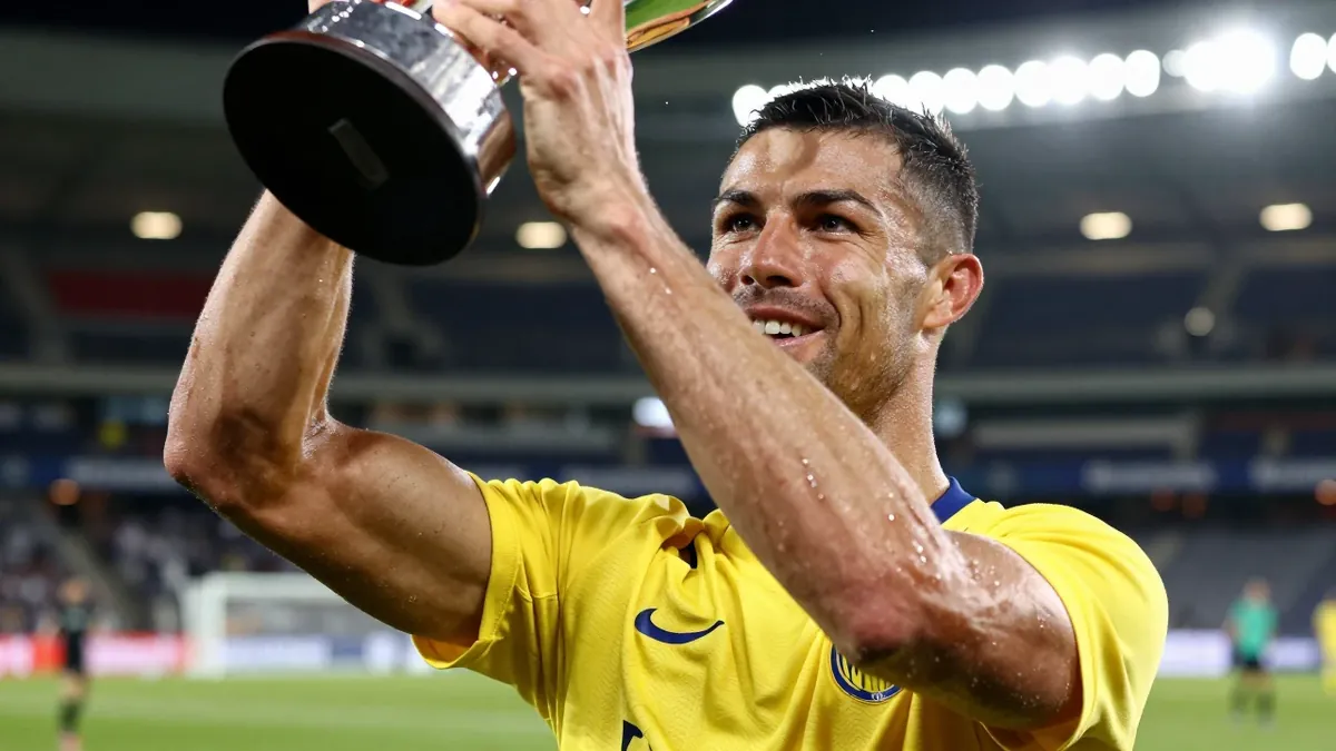 Mjällby player Elliot Stroud held the Lennart Johansson trophy after the season finale against Häcken in Allsvenskan, a...