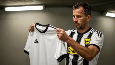 A 50-year-old Hammarby IF midfielder, 5'10" with a rugged build, stands in the dimly lit Bravida Arena tunnel, his face...
